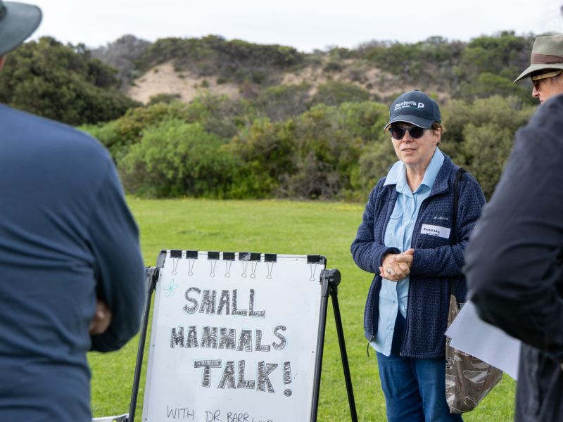 Barb Wilson standing next to a sign that says Small Mammals Talkl